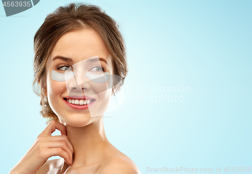 Image of beautiful young woman face with under-eye patches