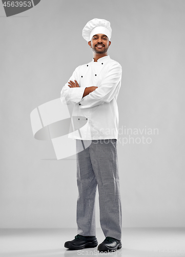 Image of happy male indian chef in toque