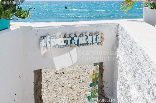 Image of The sign with text and beautiful azure sea