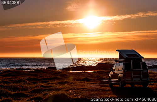 Image of Camping car minivan on the beach at sunset Lofoten beach.