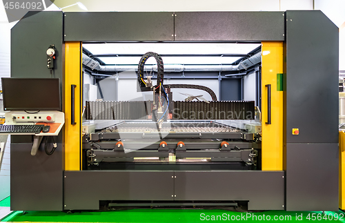 Image of CNC Laser cutting of metal, modern industrial technology.