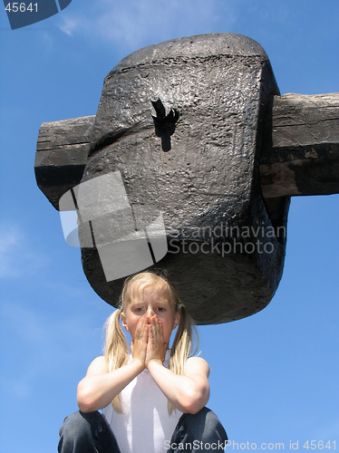 Image of Girl under large hammer