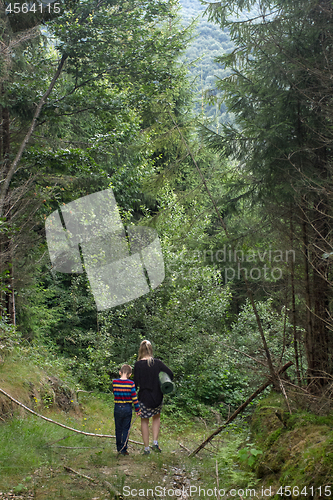 Image of Mother and son in the forest