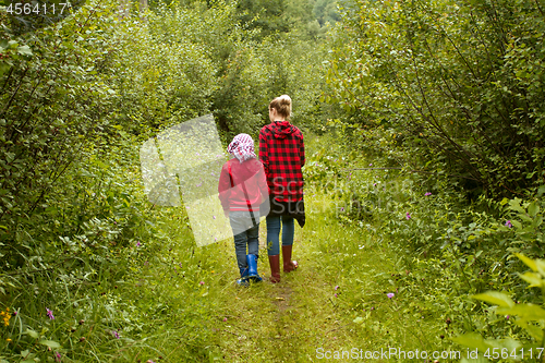 Image of Mother and son in the forest