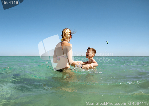 Image of Mother and son in the sea