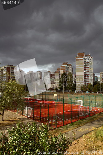 Image of Urban landscape with dark storm sky