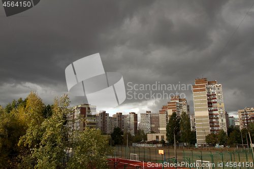 Image of Urban landscape with dark storm sky