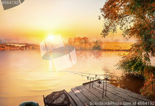 Image of Fishing equipment on wooden pier 