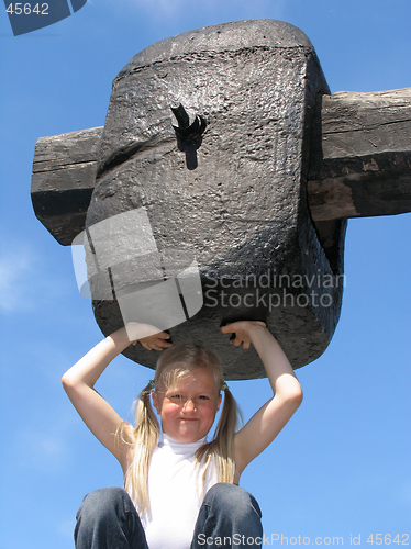 Image of Girl under large hammer