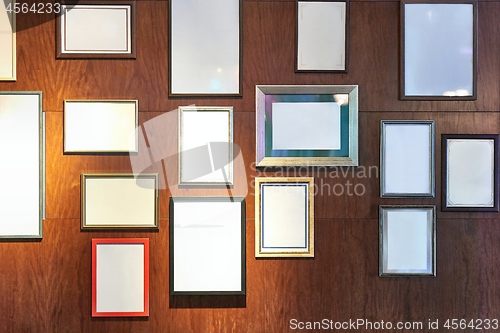 Image of Blank picture frames on a wall gallery