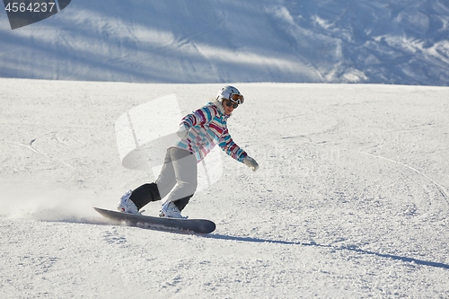 Image of Female snowboarder on the slope