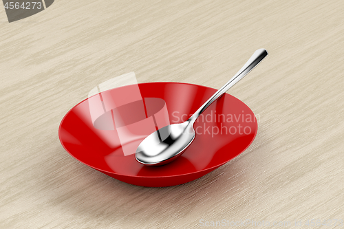 Image of Empty bowl and silver spoon