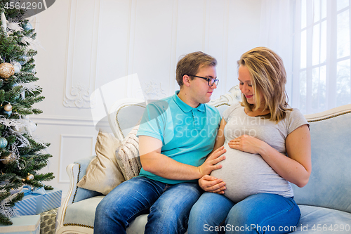 Image of Family portrait near christmas tree