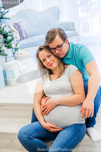 Image of Family portrait near christmas tree