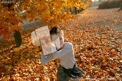 Image of Boy in Autumn Park