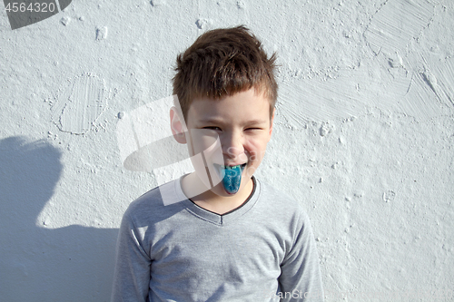 Image of Boy with blue lollipop