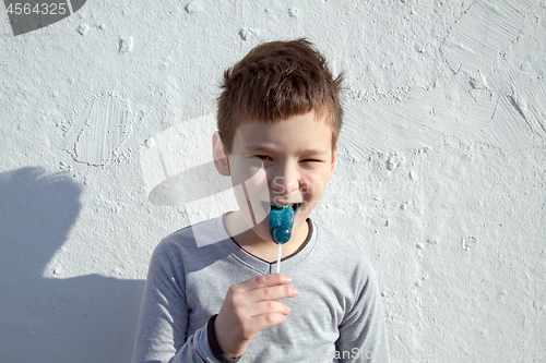 Image of Boy with blue lollipop
