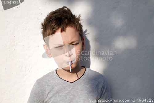 Image of Boy with blue lollipop