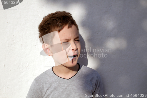 Image of Boy with blue lollipop