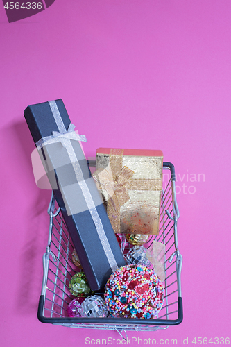 Image of Christmas toys in shopping basket