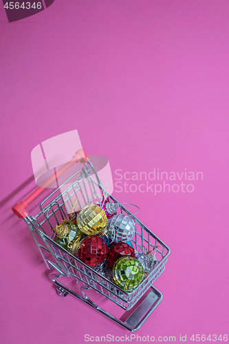 Image of Christmas toys in shopping trolley
