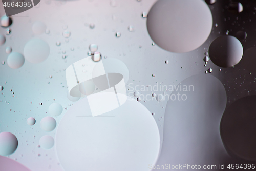 Image of Defocused pastel and dark colored abstract background picture made with oil, water and soap