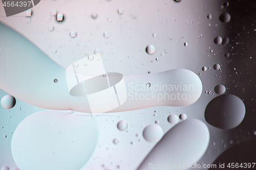 Image of Defocused pastel and dark colored abstract background picture made with oil, water and soap