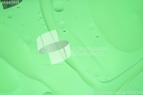 Image of Green mint abstract background picture made with oil, water and soap