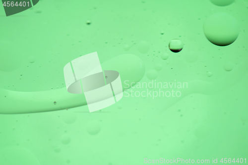 Image of Green mint abstract background picture made with oil, water and soap