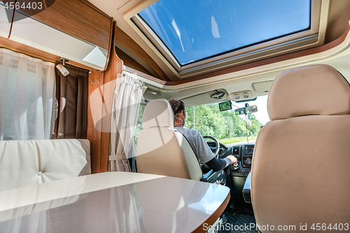 Image of Man driving on a road in the Camper Van RV