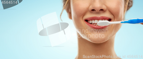 Image of close up of woman with toothbrush cleaning teeth
