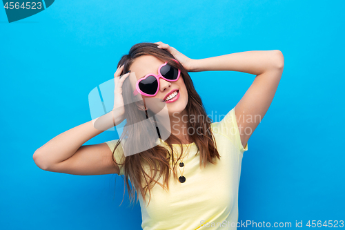 Image of teenage girl in heart-shaped sunglasses