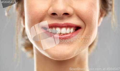 Image of close up of smiling woman face with white teeth
