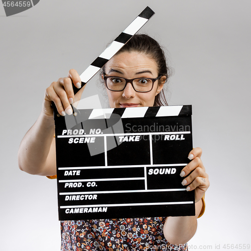 Image of Woman with a clapboard