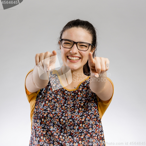 Image of Happy woman pointing