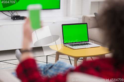 Image of young man in bathrobe enjoying free time