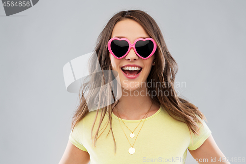 Image of teenage girl in heart-shaped sunglasses