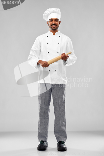 Image of happy male indian chef or baker with rolling-pin