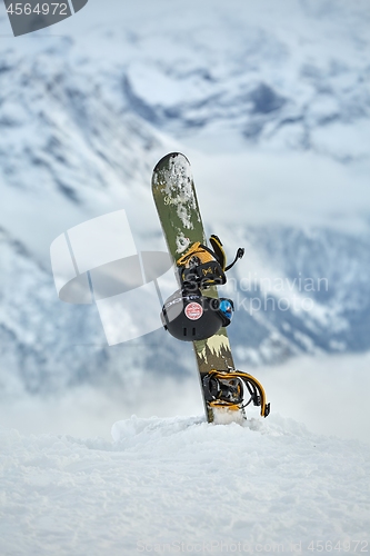 Image of Snowboard on a mountain top