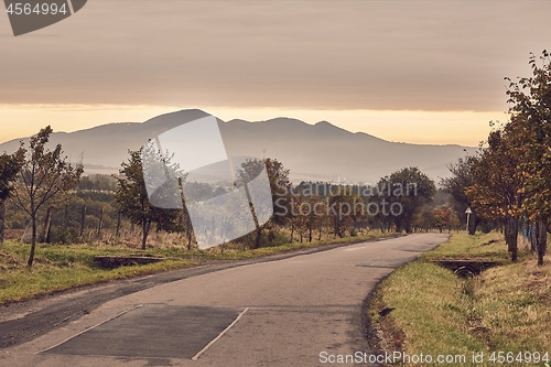 Image of Autumn road through autumn landscape