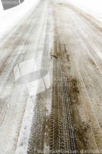 Image of traces of the car on snow