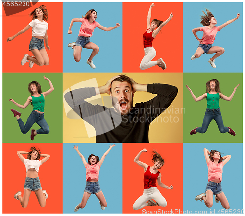 Image of Freedom in moving. young man and woman jumping against orange background