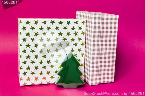 Image of Christmas decoration gift box with pink background