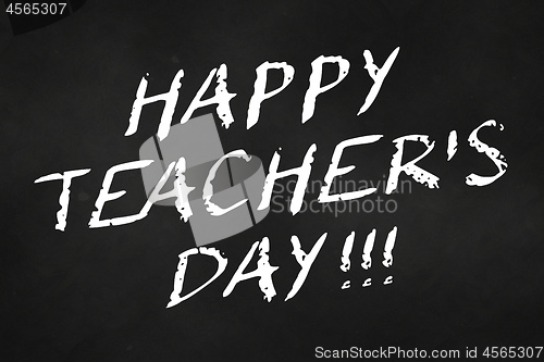 Image of happy teacher\'s day written on a chalkboard