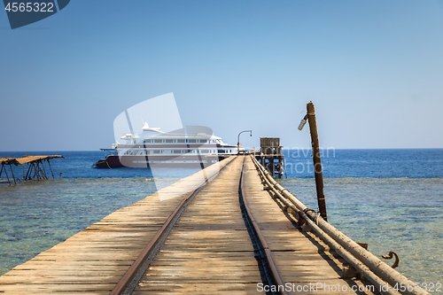 Image of Long wooden piel leading into the sea