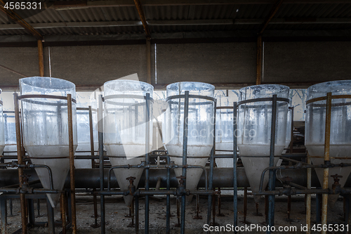 Image of Abandoned industrial interior with breeding tanks