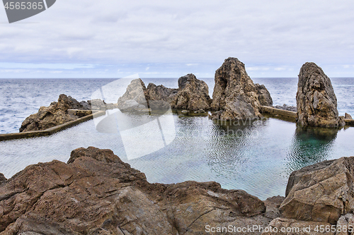 Image of Natural lava rock pool and sea in Porto Moniz in Madeira