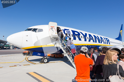 Image of Trieste airport, Italy - 20 April 2018: People boarding Ryanair plane on Friuli Venezia Giulia Airport in Trieste, italy on April 20th, 2018. Ryanair is the biggest low-cost airline company in Europe