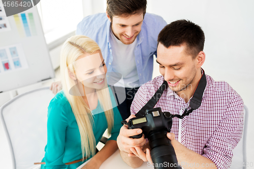 Image of photographers with camera at photo studio