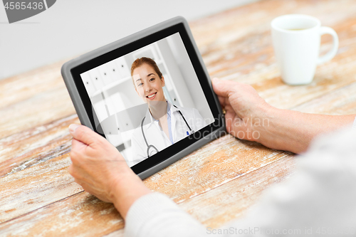 Image of senior woman patient having video call with doctor